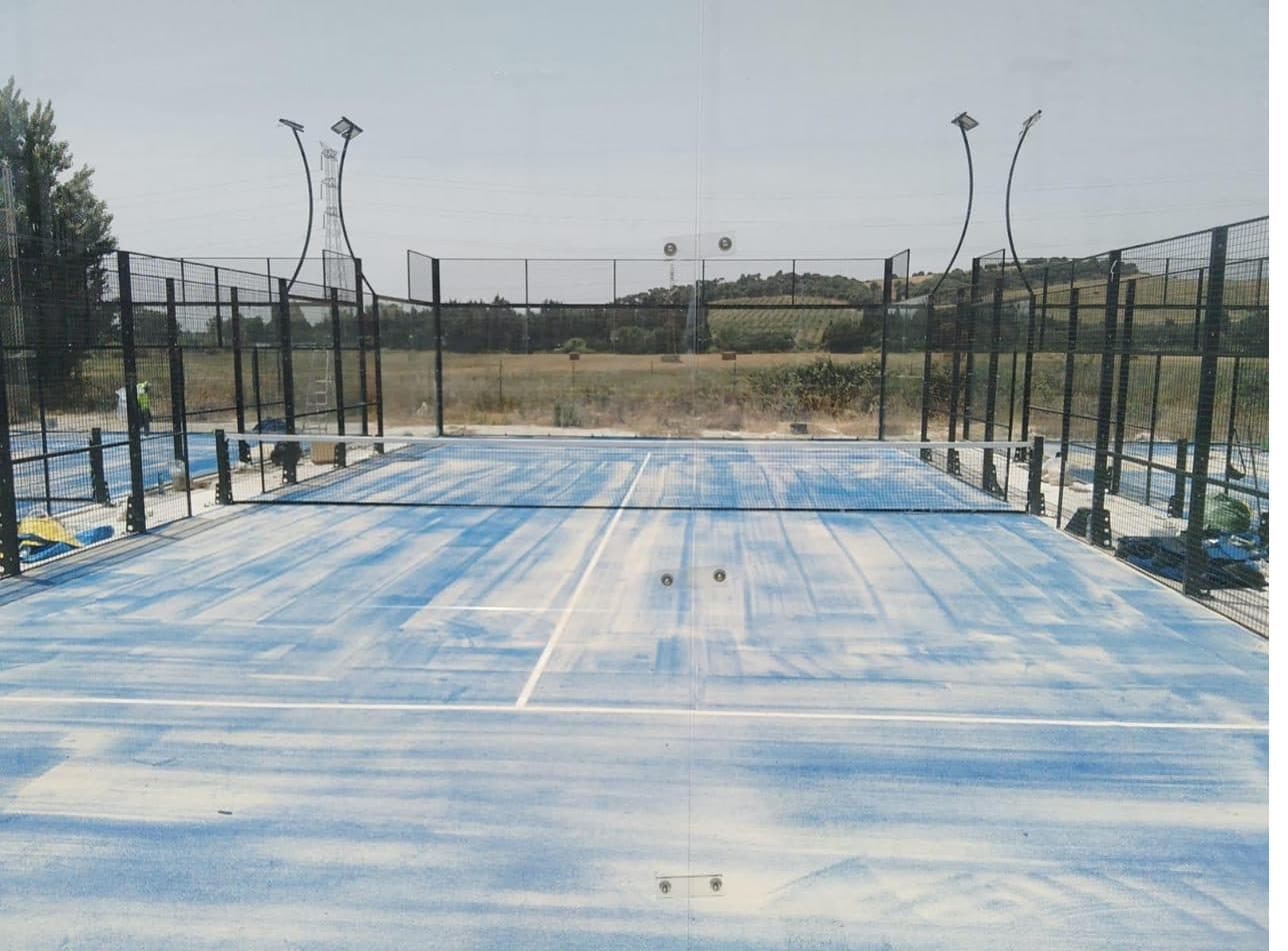Padel court at a Mediterranean resort next to the pool